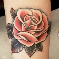 Old school colored simple rose tattoo on leg