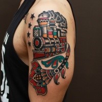 Old school colored steaming train tattoo on shoulder with stars and flower