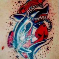 Old school colored tattoo of shark fights with anchor
