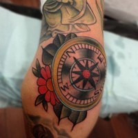 Old school compass with flowers tattoo