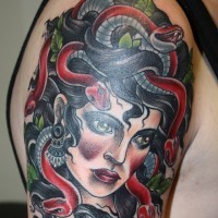 Old school cool colored forearm tattoo of Medusa with snakes portrait