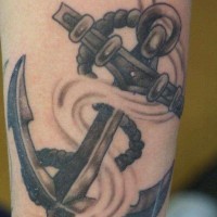 Old school gray anchor tattoo on arm