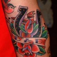 Old school horseshoe with red roses and birds tattoo