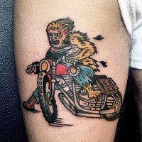 Old school illustrative style werewolf bike rider tattoo on thigh