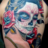 Old school Mexican traditional woman portrait tattoo on shoulder with flowers