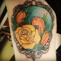 Old school multicolored flowers portrait tattoo on arm