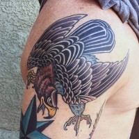 Old school multicolored shoulder tattoo of funny eagle
