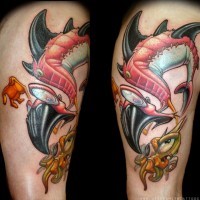 Old school multicolored thigh tattoo of funny fishes
