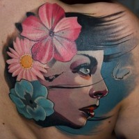 Old school multicolored woman face tattoo on upper back with flowers and butterfly