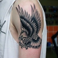 Old school painted black and white detailed little flying eagle shoulder tattoo