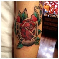 Old school red rose and horseshoe tattoo
