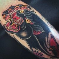 Old school style arm tattoo of evil black panther