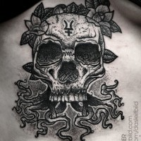 Old school style black and white cult like skull with symbols and flowers tattoo on belly