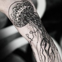 Old school style black and white detailed big jelly-fish tattoo on arm