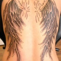 Old school style black and white wings tattoo on whole back