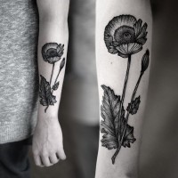 Old school style black ink big flower tattoo on arm