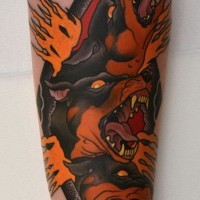 Old school style black ink hell dogs tattoo on forearm with flames