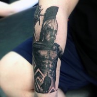 Old school style black ink Spartan warrior with dragon tattoo on arm