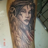 Old school style black ink woman portrait tattoo of forearm with dream catcher