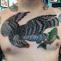 Old school style colored and detailed big eagle with fish tattoo on chest