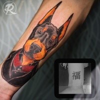 Old school style colored arm tattoo of cute dog in suit