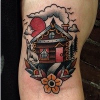 Old school style colored arm tattoo of old house with flowers and wolf