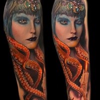 Old school style colored arm tattoo of creepy woman with octopus