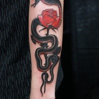 Old school style colored arm tattoo of big snake with rose