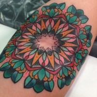 Old school style colored arm tattoo of ornamental flowers
