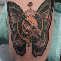 Old school style colored arm tattoo of butterfly with arrow and violin