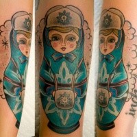 Old school style colored arm tattoo of Russian Matryoshka with lettering
