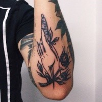 Old school style colored arm tattoo of woman hand with dagger and flowers