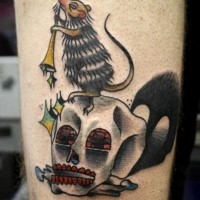 Old school style colored arm tattoo of human skull and little mouse
