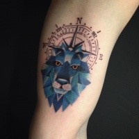 Old school style colored arm tattoo of blue lion head with compass