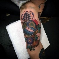 Old school style colored biceps tattoo of little ship with globe and flowers
