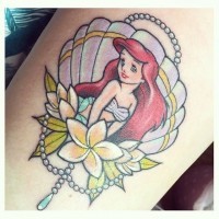 Old school style colored cartoon like mermaid tattoo stylized with flowers and shell