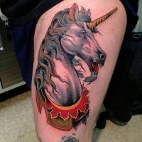 Old school style colored detailed thigh tattoo of unicorn
