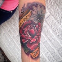 Old school style colored forearm tattoo of beautiful flowers and lettering