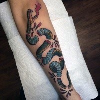 Old school style colored forearm tattoo of corrupted snake