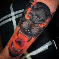 Old school style colored forearm tattoo of demonic hell dog