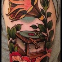 Old school style colored gramophone tattoo on shoulder with flowers and flames
