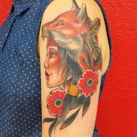 Old school style colored gypsy woman with fox helmet tattoo on shoulder stylized with flowers