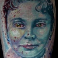 Old school style colored leg tattoo of vampire woman face