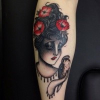 Old school style colored leg tattoo of sad woman with flowers