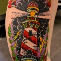 Old school style colored leg tattoo of creepy lighthouse and lettering