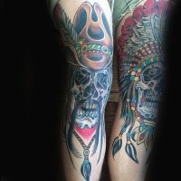 Old school style colored legs tattoo of Indian and cowboy skulls