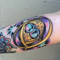 Old school style colored little magical mechanism tattoo on forearm with stars