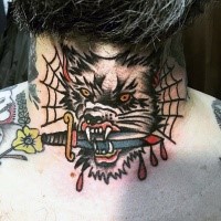 Old school style colored mad wolf with bloody dagger in mouth tattoo on neck with spiderweb