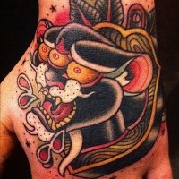 Old school style colored mystical black panther with three eyes tattoo on hand