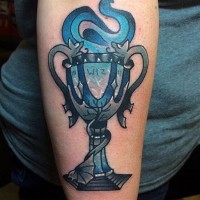 Old school style colored on forearm tattoo of big cup